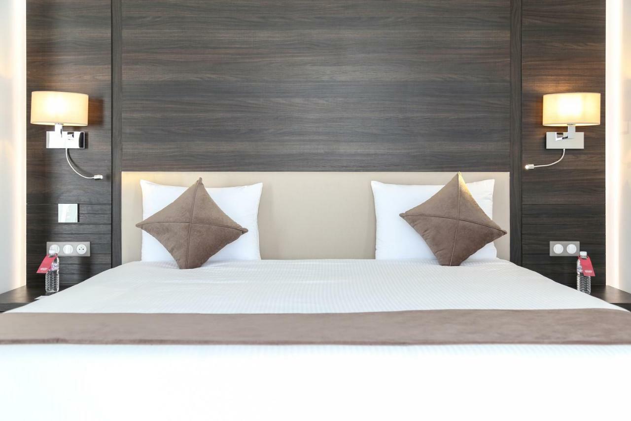 Radisson Hotel Sfax Eksteriør billede A bed